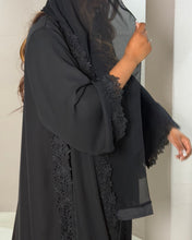 Load image into Gallery viewer, Black abaya with lace details on a plain background