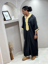 Load image into Gallery viewer, Rear view of Moroccan thobe in black with subtle gold embellishment