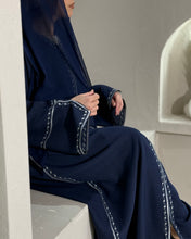Load image into Gallery viewer, Detailed view of navy linen abaya showcasing intricate embroidery on the sleeve