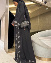 Load image into Gallery viewer, Model in full body shot wearing elegant silver lace abaya for Eid