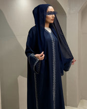 Load image into Gallery viewer, Side view of full-length navy linen abaya with embroidered accents