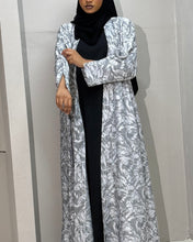 Load image into Gallery viewer, Model walking in jacquard abaya showing cloche cut flow