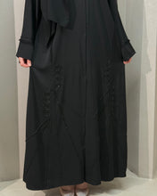 Load image into Gallery viewer, Model in luxurious frayed embellished abaya styled for Eid celebrations