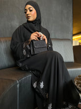 Load image into Gallery viewer, Model showcasing silver lace abaya with graceful flow and modest design