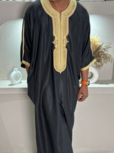 Load image into Gallery viewer, Side profile view of premium black Moroccan thobe with gold accents