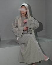 Load image into Gallery viewer, Front view of beige linen abaya with stunning handmade sleeve embellishments
