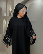 Load image into Gallery viewer, Black linen blend abaya with detailed handmade sleeve embellishment for elegant modest wear
