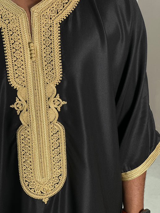 Full front view of premium black Moroccan thobe with gold detailing