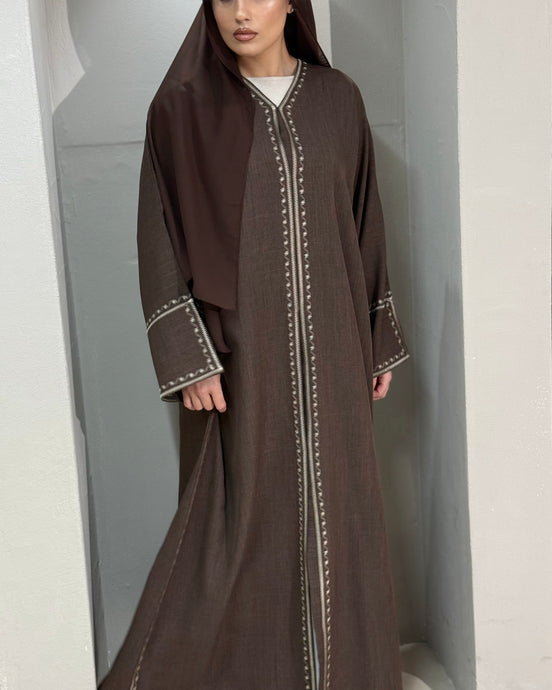 Front view of chocolate brown linen abaya with split sleeves and fine embroidery