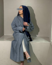 Load image into Gallery viewer, Front view of denim blue linen abaya with split sleeves and embroidery
