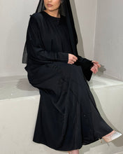 Load image into Gallery viewer, Sleeve detail of frayed abaya showcasing luxury embellishments and texture
