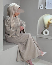 Load image into Gallery viewer, Full-length beige abaya in linen blend with handcrafted sleeve embellishment
