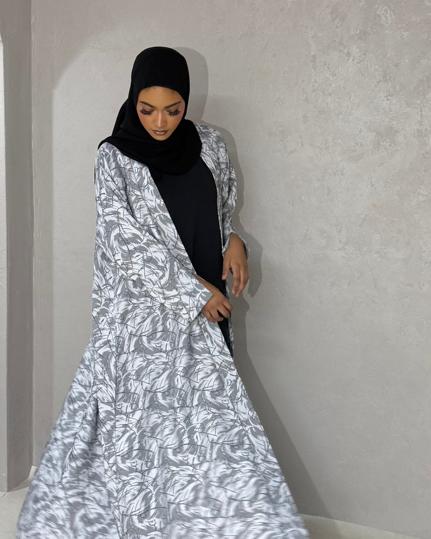 Front view of elegant jacquard patterned abaya set in cloche cut