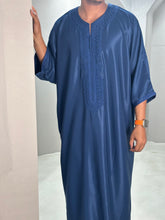 Load image into Gallery viewer, Model wearing navy Moroccan thobe with elegant embroidery
