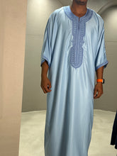 Load image into Gallery viewer, Model styled in sky blue Moroccan thobe with traditional embroidery
