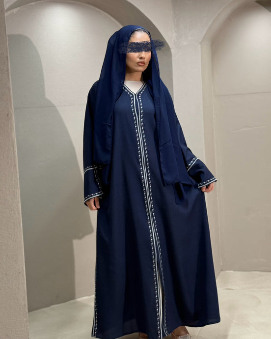 Front view of navy linen abaya with intricate embroidery and split sleeves

