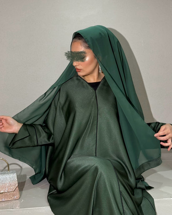 Front view of forest green shimmery satin abaya with elegant piping

