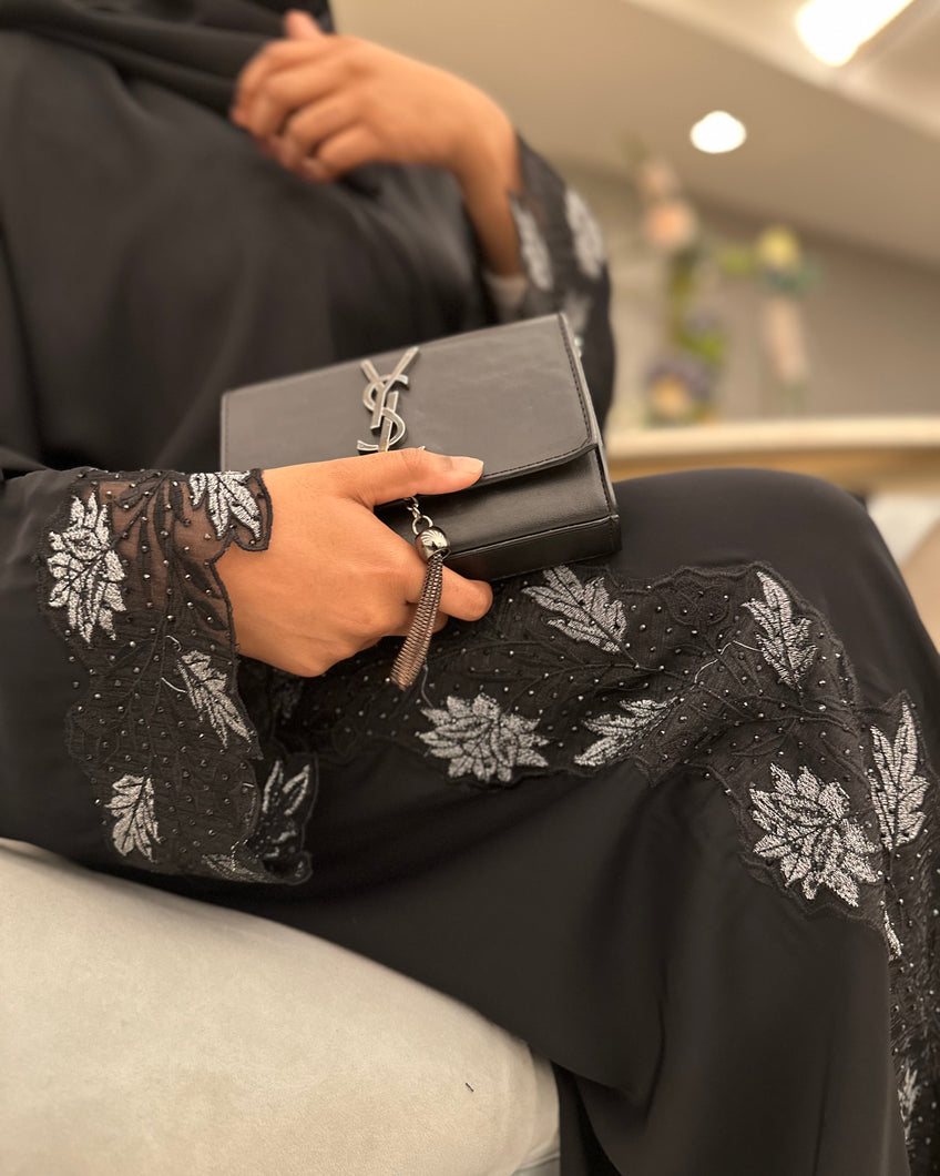 Front view of elegant silver lace abaya designed for Eid celebrations