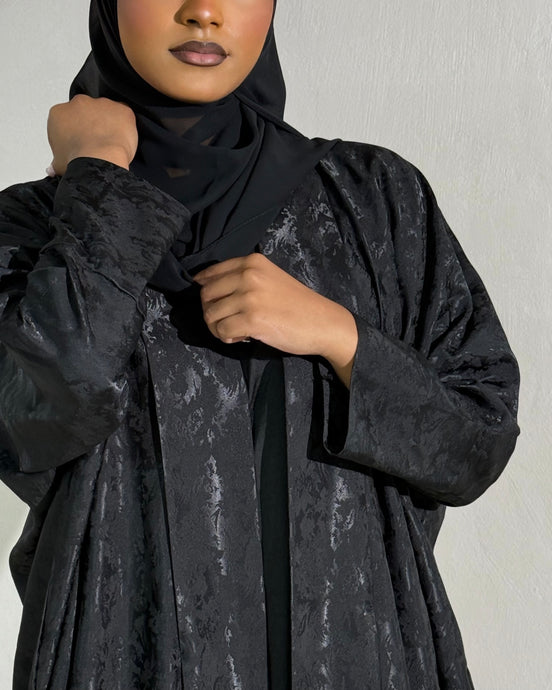 Front view of Patterned Black Open Abaya with tailored sleeves