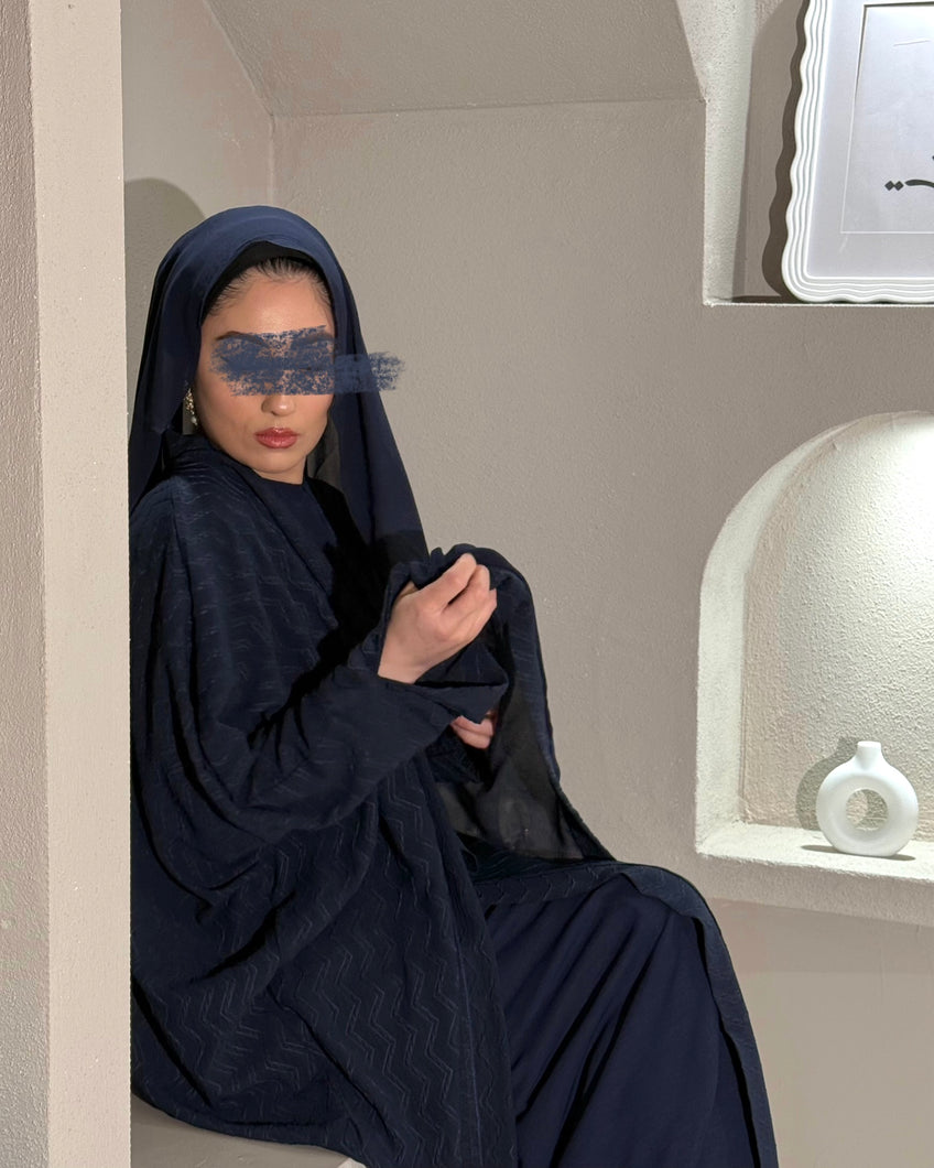 Front view of navy zigzag patterned butterfly abaya set